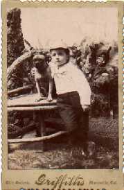 Eugene O'Neill with arm around puppy